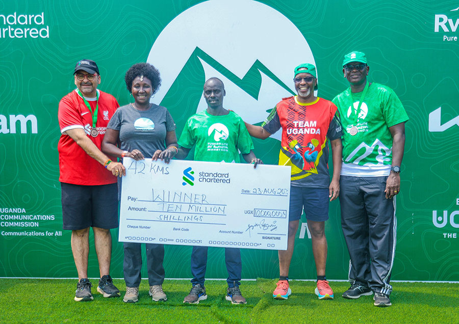 L-R Standard Chartered CEO Sanjay Rughani, Rt Hon deputy speaker of parliament of Kenya Gladys Boss Shollei, Bernard Cheptoch(C), Equator Hikes Director Amos Wekesa and UBL Managing Director Andrew Kilonzo pose for a photo during the award ceremony. Courtesy photo
