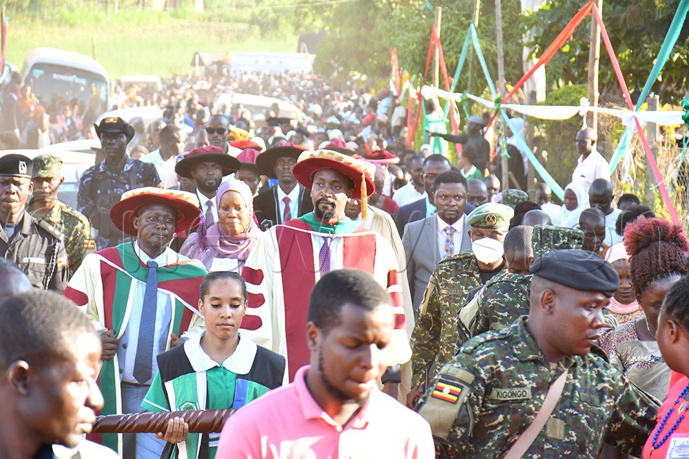 Kyabazinga William Gabula Nadiope IV (C) flanked by Prof. Dr. Muhamadi Lubega (2nd L) as he was walking away from the graduation venue at Lubega Institute of Nursing and Health Professionals at Busei village in Iganga district on May 30th, 2026. (Photo by Donald Kiirya)