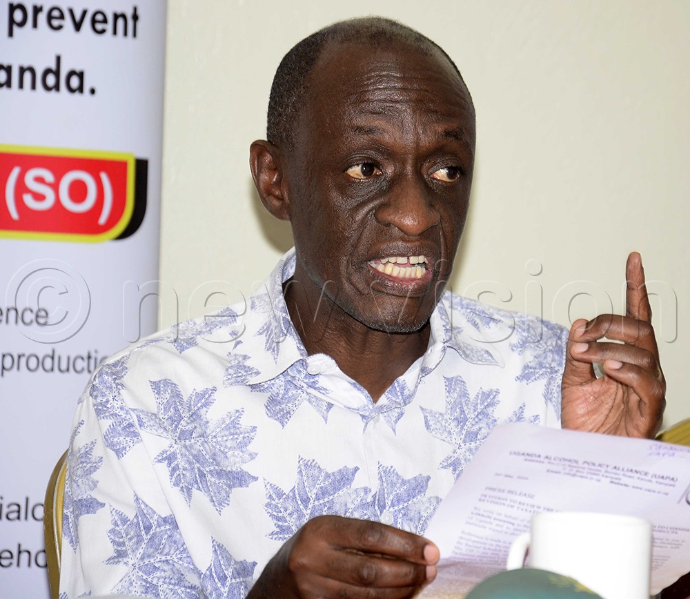 Richard Baguma of Uganda Health Communication's Alliance addressing the media about taxes on Alcohol. (Photo by Margaret Zalwango)