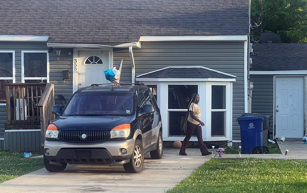 A woman is seen outside the house where a mass shooting took place in Shreveport, Louisiana, on April 19, 2026. Eight children were killed in a shooting spree early April 19 in the southern US state of Louisiana, in what police said appears to have been an incident of domestic violence. (Credit: AFP)