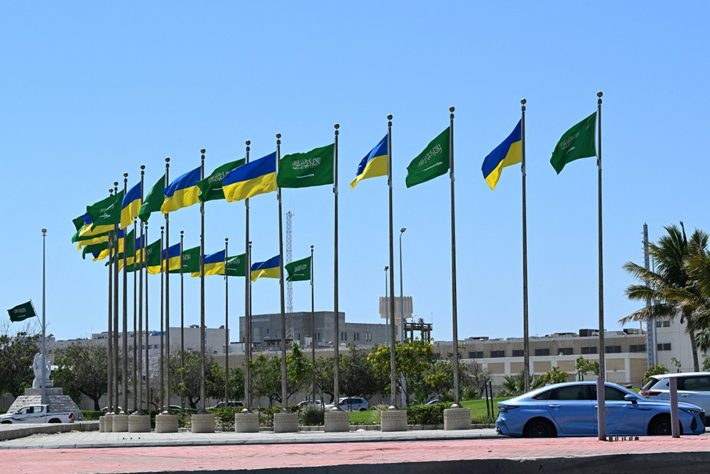 Flags of Saudi Arabia and Ukraine line the King Abdulaziz Road in the Saudi Red Sea port city of Jeddah ahead of a visit by the Ukrainian President on March 10, 2025. (Photo by Amer HILABI / AFP)