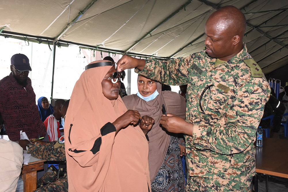 A UPDF Optician offering optical care to a patient. (Credit: UPDF)