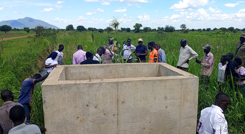 Agoro sub-county Chairperson George Onek listed multiple technical and administrative concerns, including delayed works, poorly buried pipes, siltation of the reservoir dam and lack of engagement. (Photo by Christopher Nyeko) 