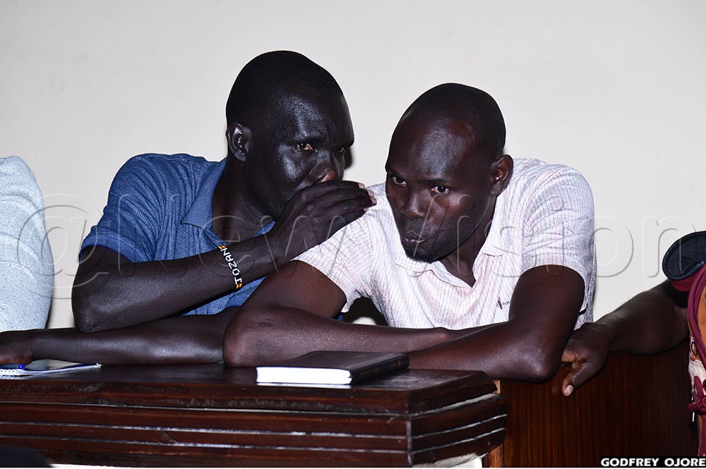 Okedi and his younger brother Obotol in the dock after being convicted of murder