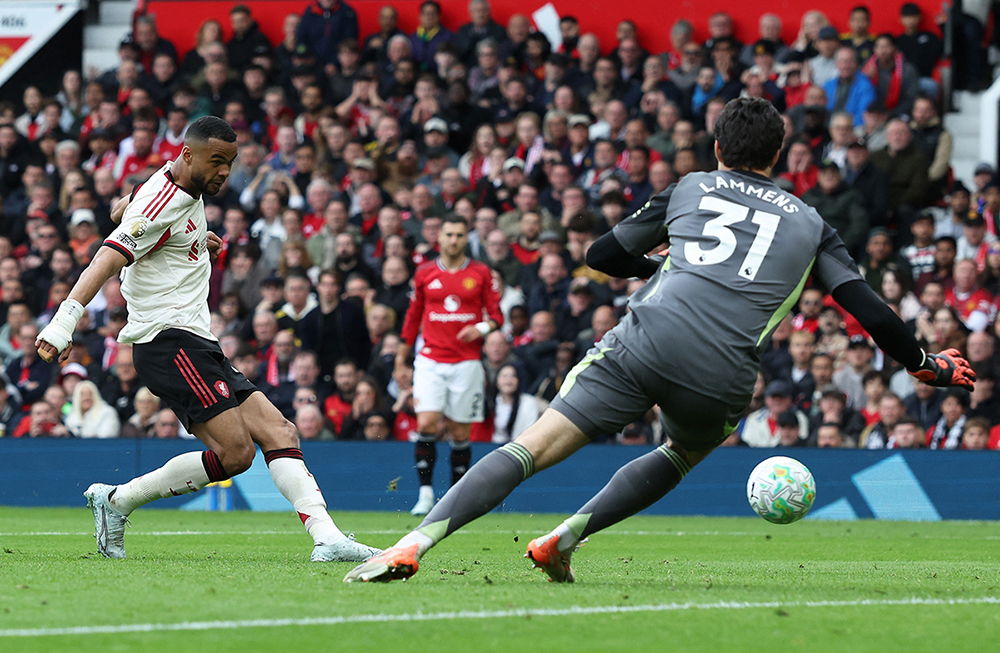 Liverpool's Dutch striker #18 Cody Gakpo scores the team's second goal during the English Premier League football match between Manchester United and Liverpool at Old Trafford in Manchester, north west England, on May 3, 2026. 