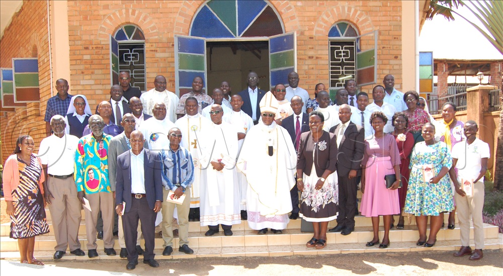 Archbishop Paul Ssemogerere (wearing a mitre) shares a photo moment with the participants after the Eucharistic celebration for the official opening of the study workshop for the diamond jubilee of the Decree on the Apostolate of the Laity at Ulrika Guest House, Kisubi, in Wakiso district on Tuesday, November 18 2025. 