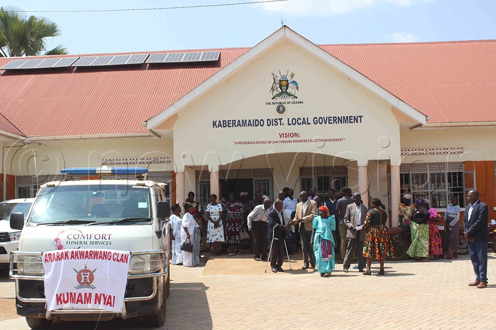 A funeral van carrying the casket of the late James Eboku as it left Kaberamaido District Council after he was honoured on August 10 2026, in Kaberamaido, with mourners following. (Photo by Michael Onyinge)