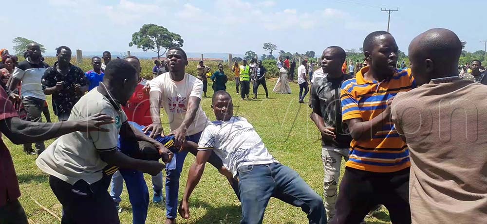 Residents in serious fighting which ended in a woman's lip being bitten off at Bunakijja village in Katosi Town Council, Mukono district. (Credit: Henry Nsubuga)