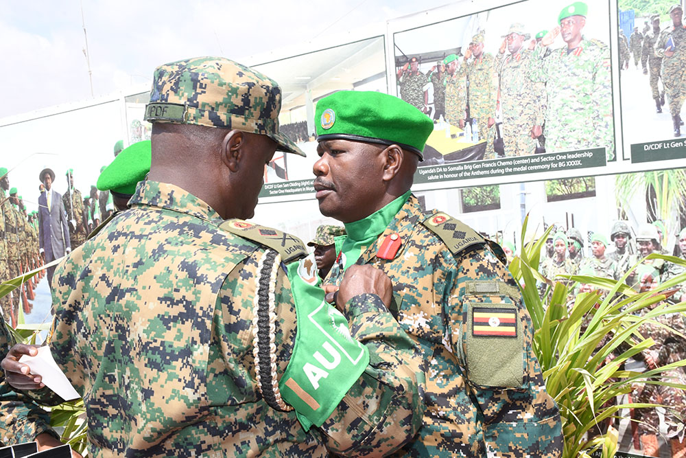 Col Michael Hyeroba receiving his medal.