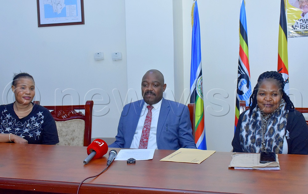  Fiona Namuddu (left) with friend Rebecca Nakasaga (right) jointly addressing the press with Henry Wabyona, the deputy head of State House Diaspora Unit. (Photo by Julius Luwemba) 
