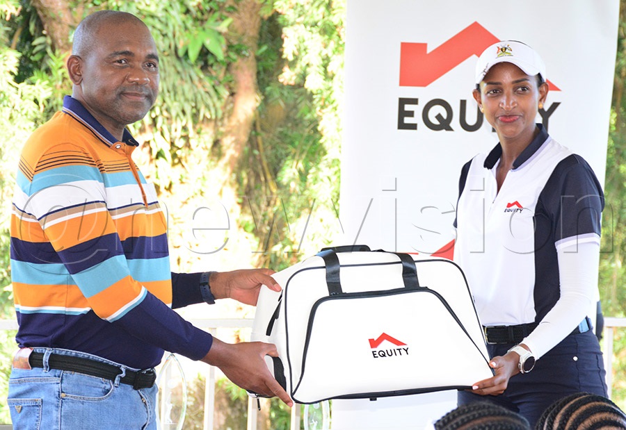 The Managing director of Equity Bank Uganda Gift Shoko (left) presents a gift to Uganda Parliament Golf Team's Sylivia Nayebare after the tournament at Entebbe Club, June 3, 2026. Photo by Michael Nsubuga