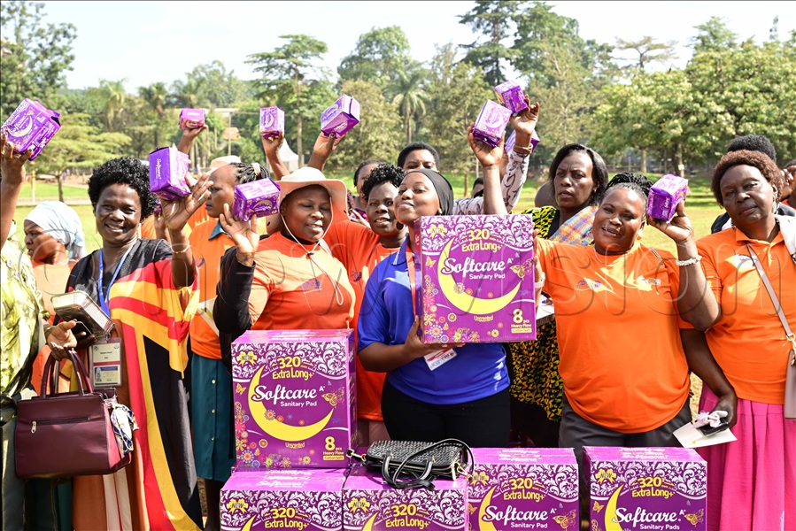 Hanifa Nabukenya from Softcare giving out pads to women. (Credit: Eddie Ssejjoba)