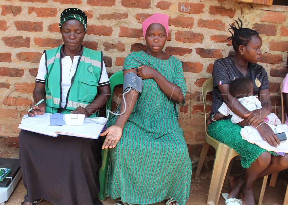A pregnant mother having her blood pressure tested during the health camp.