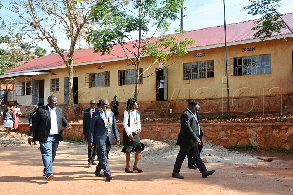 Rotary International District 9214 (Uganda and Tanzania) District Governor Daniel Mukasa Ddamulira (centre), Impact President of the Rotary Club of Akright City Ann Kawooya Nsubuga (second right) and other Rotarians tour the school’s renovated roof during a visit to St Padre Pio Kabulamuliro Primary School in Bwebajja, Wakiso District, on Sunday, September 27, 2026. (Photo by Francis Emorut).
