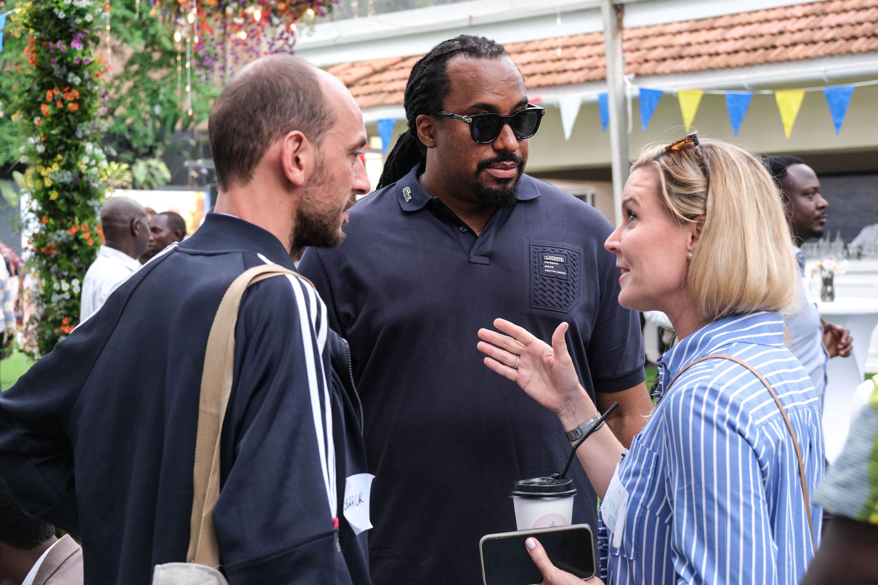 Rapper Navio chats with guests at the Nordic-Uganda partnership day held at the Danish Ambassador's residence. Photo by Hajara Nalwadda