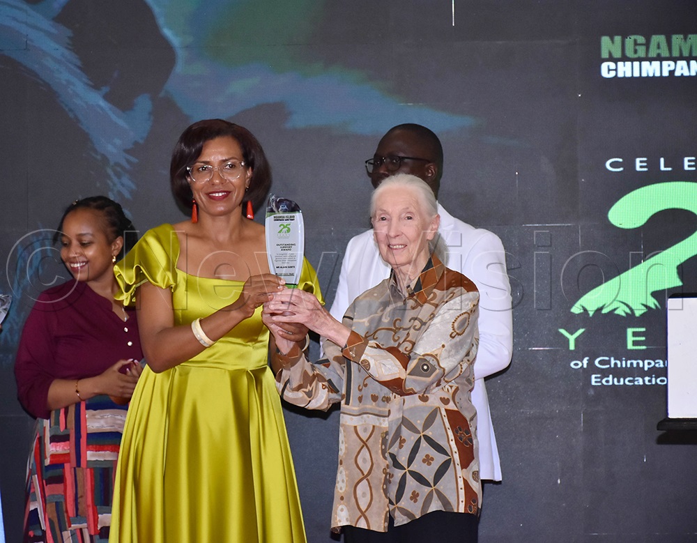 Lilly Ajarova, the former chief executive officer for Uganda Tourism Board, receiving a prestigious award from Jane Goodall, for her outstanding work in tourism and conservation, having steered Ngamba chimpanzee sanctuary for 14 years. (Credit: Julius Luwemba)
