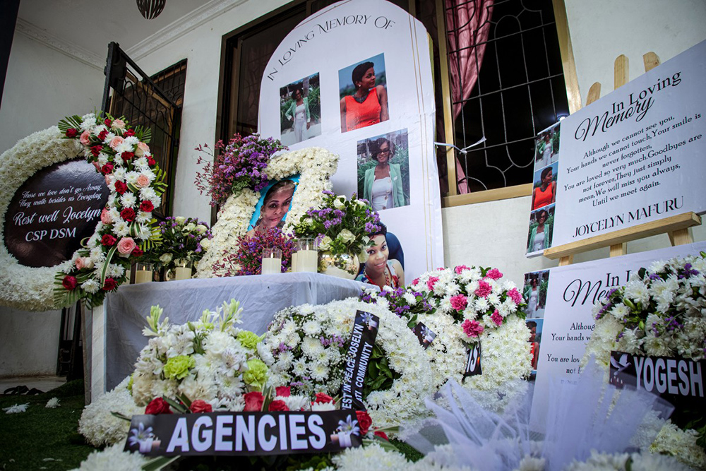 Flowers are displayed in memory of Jocelyn Mafuru at her family home in Kigamboni District, Dar es Salaam, on November 8, 2025. Mafuru was killed on October 30, 2025, while traveling from a ward in Dar es Salaam to the airport during violent protests following Tanzania's presidential election on October 29, 2025. (Photo by AFP)
