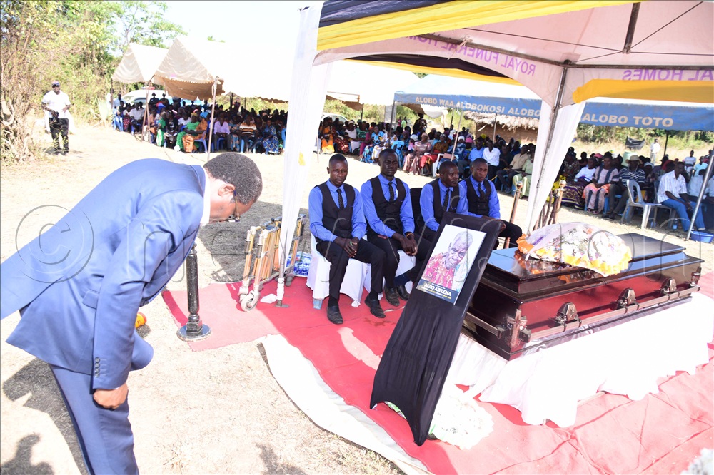 Dr Kenneth Omona paying his last respect.