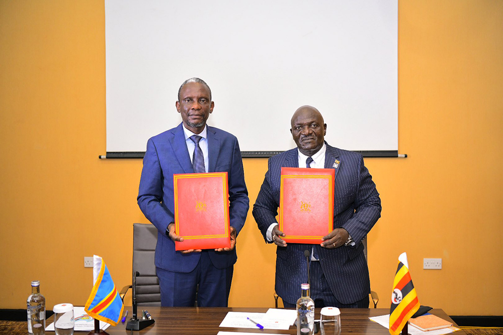 Uganda's works minister Gen. Edward Katumba Wamala (Right) and DRC's infrastructure minister John Banza Lunda (Left) during the meeting at Munyonyo. (Courtesy/Ministry of Works & Transport)