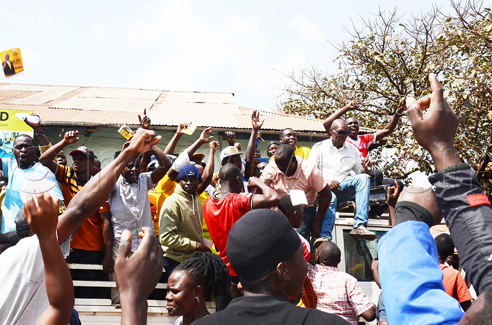 Voters appearing at the polling station in a vehicle shortly before voting, as massive crowds participated in village elections at Pepsi Cola village in Kampala. (Photo by Isaac Nuwagaba)