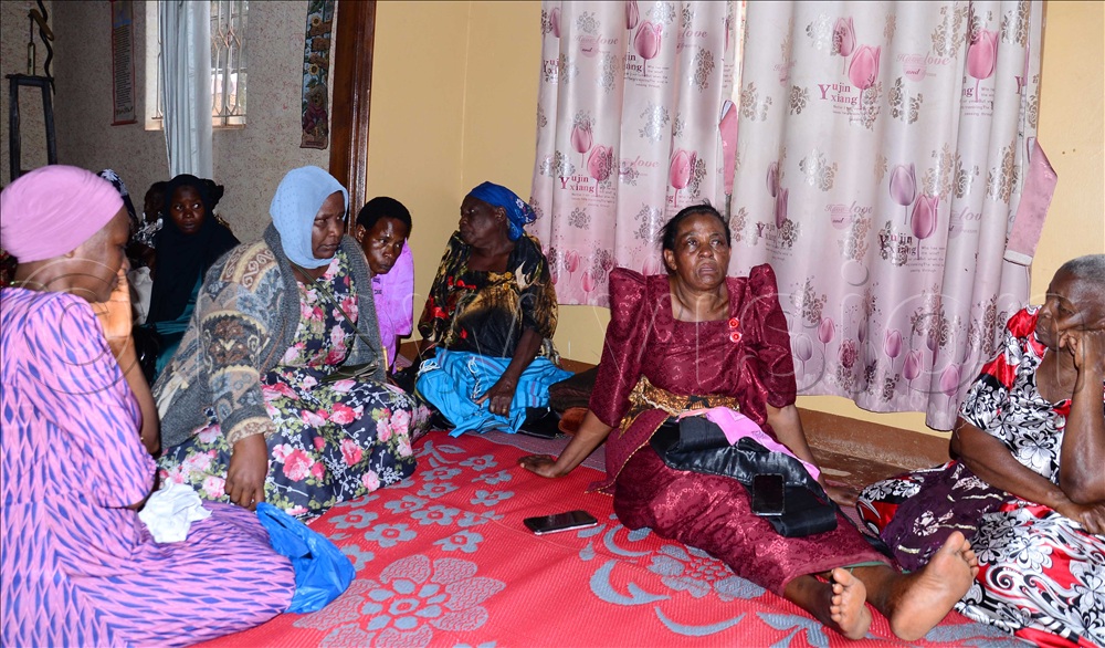 Sarah Naggayi Batiibwe (Right) with other mourners at the deceased's home in Bulaga, on Thursday, October 01, 2026. (Photo by Stuart Yiga)