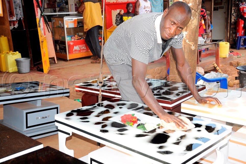 Henry Bukenya at work in his workshop. (Photo by Umar Nsubuga)