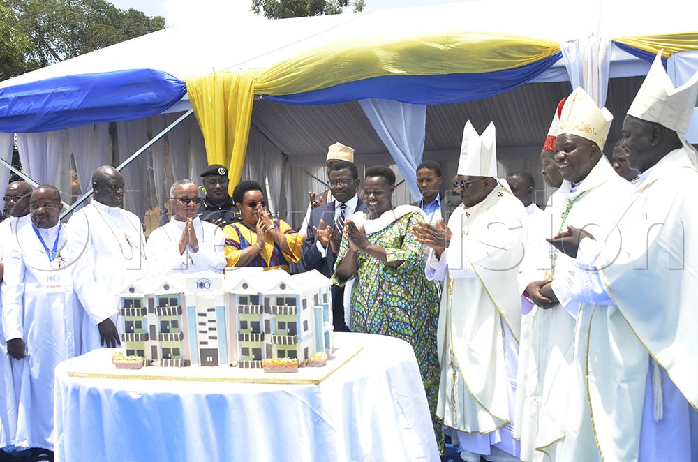 The Vice-President, Jessica Alupo, Katikiro of Buganda, Charles Peter Mayiga, Prince Kassim Nakibinge, Bishops and priests cuts a cake after the centenary event at Kisubi on Saturday September 5, 2026. (Credit: Juliet Anna Lukwago)
