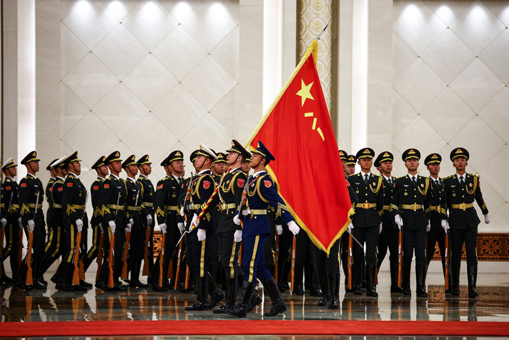 Chinese honour guards prepare for a welcome ceremony for France's President Emmanuel Macron at the Great Hall of the People in Beijing on December 4, 2025. (Photo by Sarah Meyssonnier / AFP)