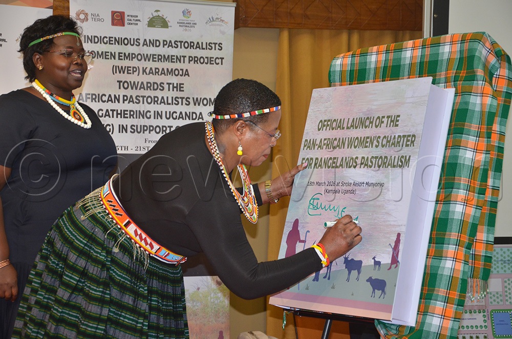 Speaker Anita Among appends her signature on the  pastoralist charter at Speke Resort Munyonyo in Kampala. (Photo by Olandason Wanyama)