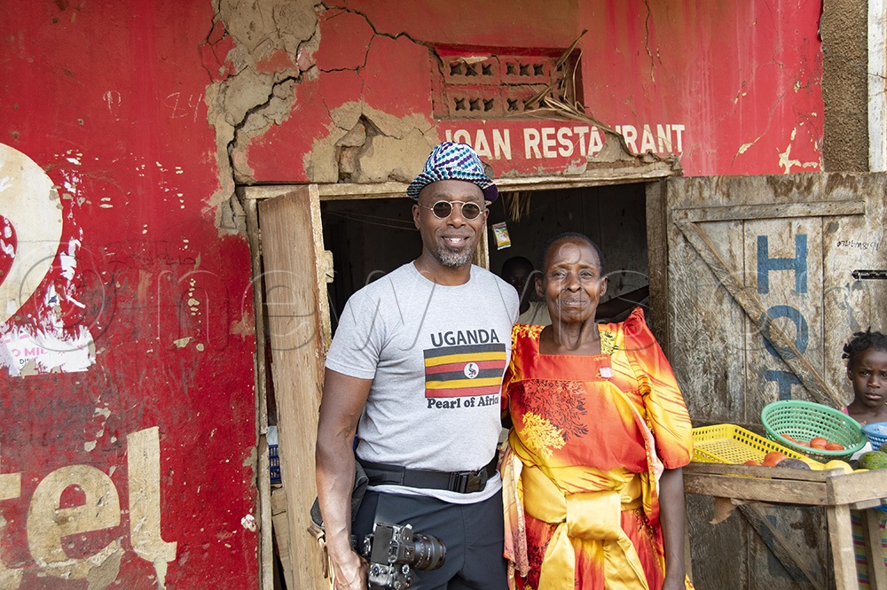 Ntare Mwine with Nanyonjjo, widow of SsalongO Alosyius Kibaate, in Mbirizi on Friday. (Photo by Kalungi Kabuye)