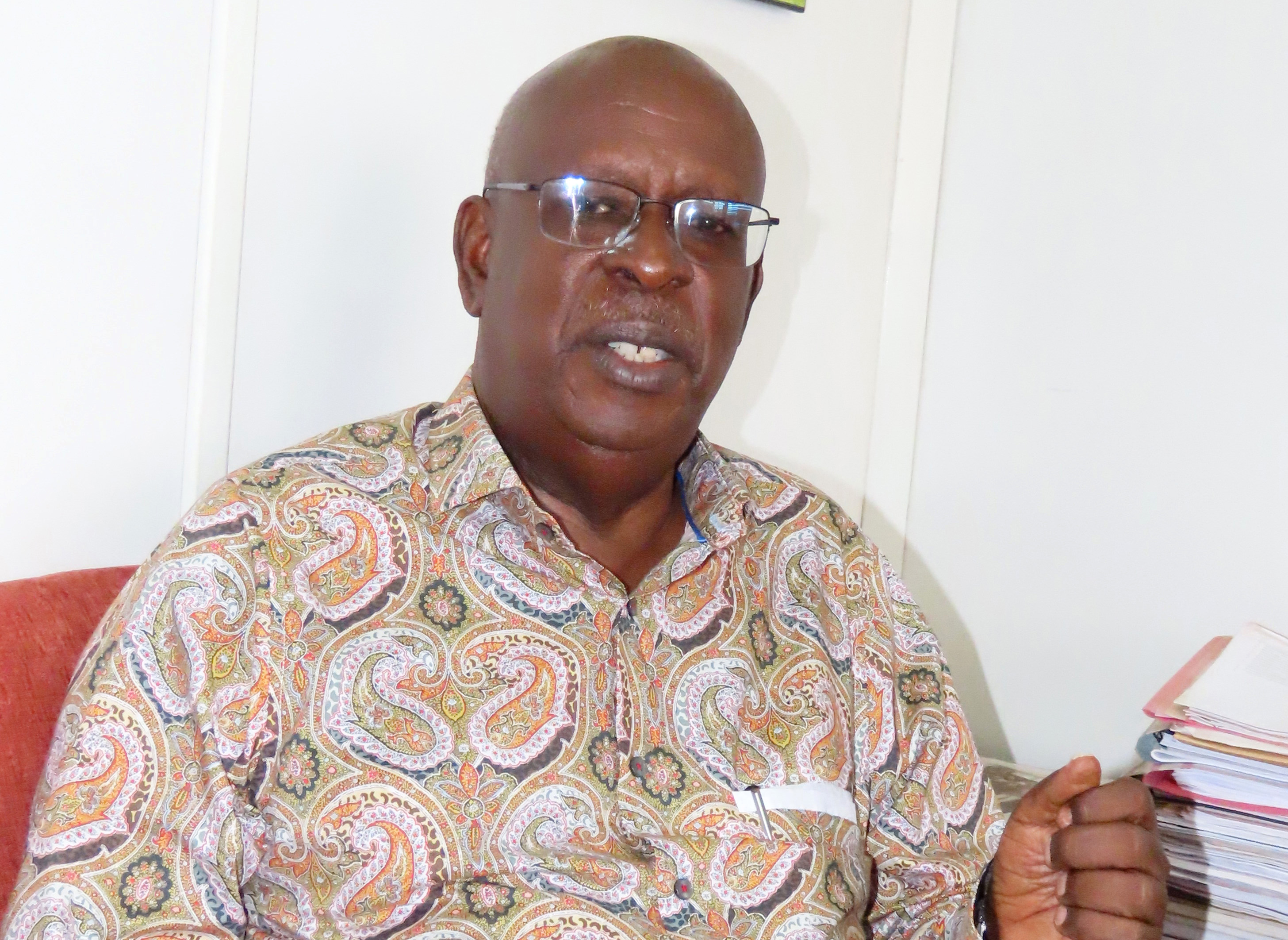 James Tumusiime at his Fountain Publishers Office. Tumusiime still speaks of them like wayward sons, equal parts mischief, madness and memory. (Photo by Titus Kakembo)