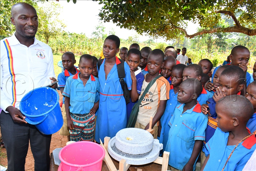 The Director General of Busoga Consortium for Development Anthony Mula (L) explaining about the Soya Milk feeding program in schools while at Buteme Light SDA Primary School in Kamuli district.