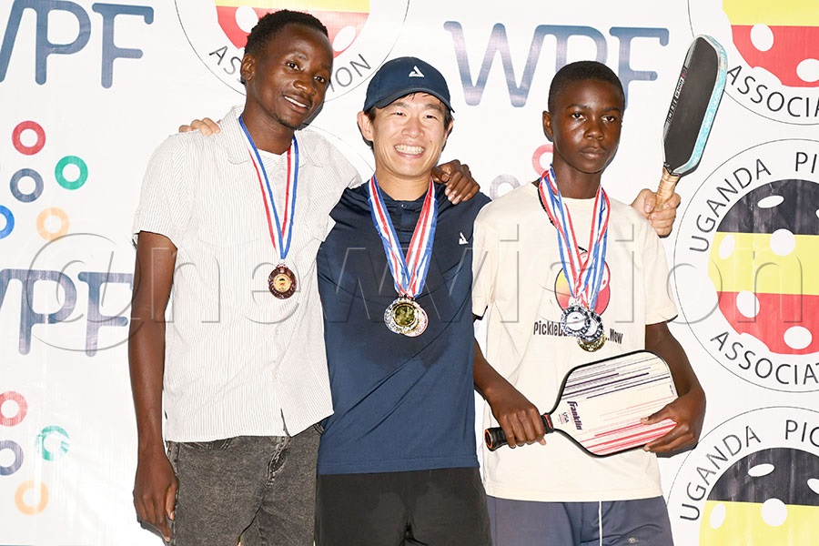Naoya Nishimura (center) who won the Uganda Pickleball Open poses with Benjamin Acuma (left) and James Mugula after the Pickleball Uganda Open at the Old Kampala Sports Arena. Photo by Michael Nsubuga