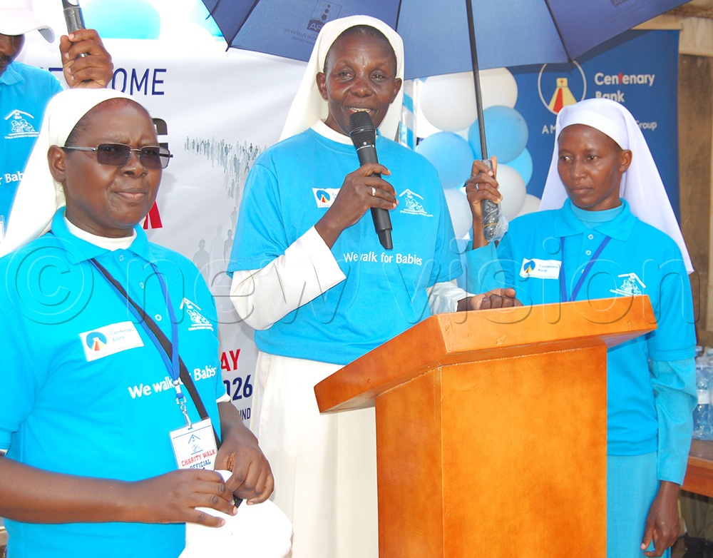 The Director of Child Welfare and Adopton Society, Sr.Sarah Nnaamala (holding a microphone) delivers her thanksgiving remarks. Lef is the Administrator of Nsambya Babies Home, Sr. Teddy Nakyanzi. (Photo by Mathias Mazinga)