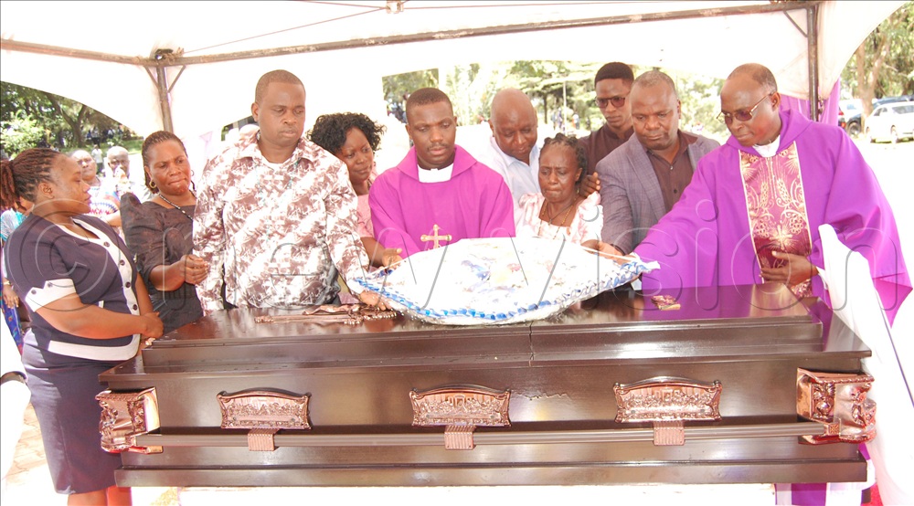 Christians from Mpigi Catholic parish  laying a wreath on the casket containing the remains of Fr. Emmanuel Mukasa  This was during the deceased priest's Christian burial mass at Kisubi Minor Seminary on Entebbe Road, in Wakiso district on Wednesday, February 4, 2026. 