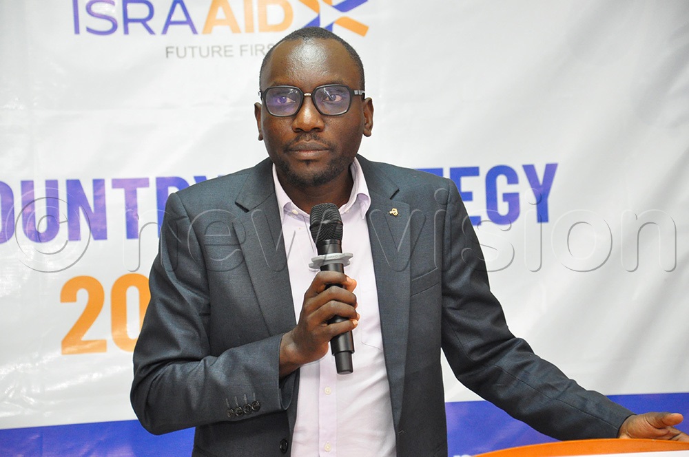   Richard Duuki from UNHCR addressing participants during the launch of 2025–2028 Strategy to Strengthen Refugee Resilience. (Photo by Nancy Nanyonga)