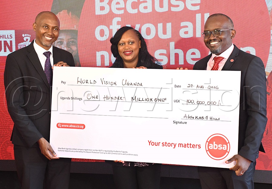 Absa Bank MD David Wandera (right) presents a sh100m cheque to the World Vision national director Jeremiah Nyangah (left) and his colleague at Absa offices, August 27, 2026. Photo by Michael Nsubuga