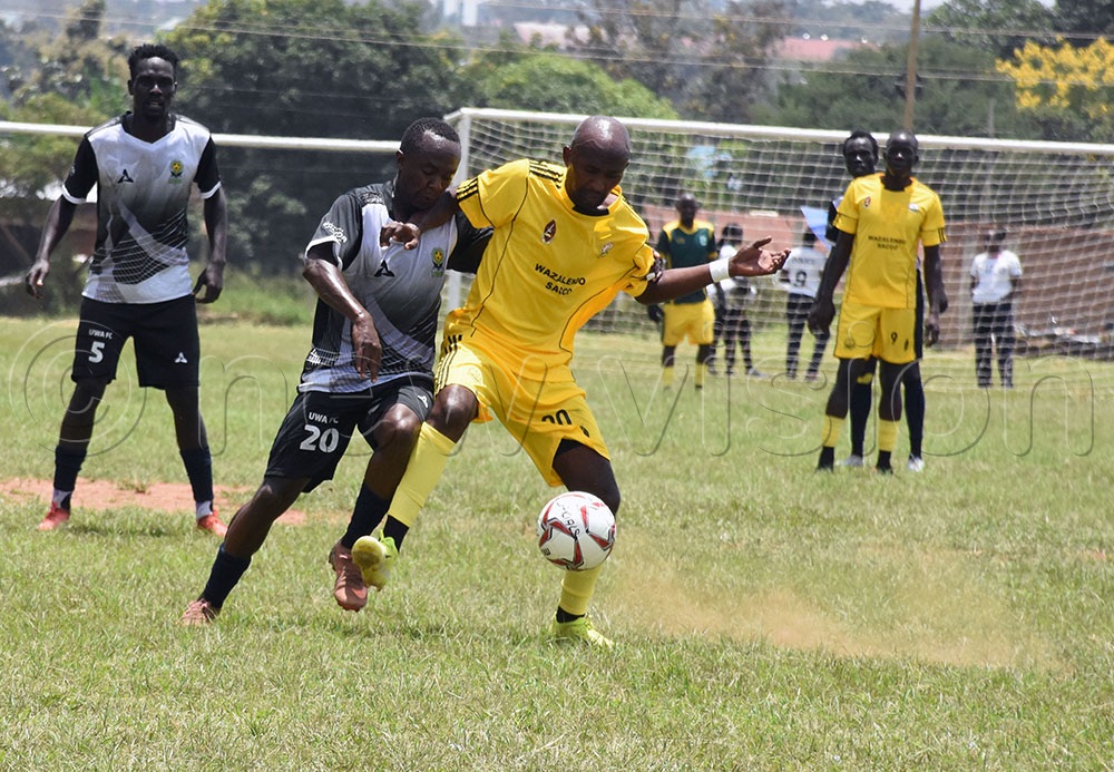 Uganda Wildlife Authority (UWA) playmaker Media Matovu (No. 20) contesting for the ball with UPDF's Oscar Agaba (No. 20) in the opening encounter of the Inter-Force-Games. The game ended in a 1-1 draw. (Photo by Dennis Ojwee)