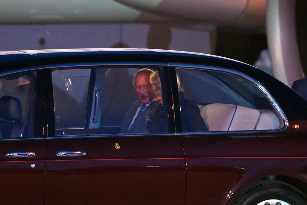 Britain's King Charles III and Britain's Queen Camilla leave Rome's Ciampino airport by car on the eve of a visit to the Vatican, on October 22, 2025. (Photo by Filippo MONTEFORTE / AFP)