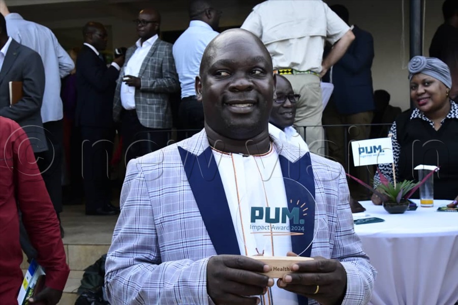 Moses Kyangwa, the founder of Busoga Health Forum, after winning this year's Professional People for Positive Impact (PUM) best performance award at a function held at her residence in Kololo, Kampala. (All Photos by Eddie Ssejjoba)