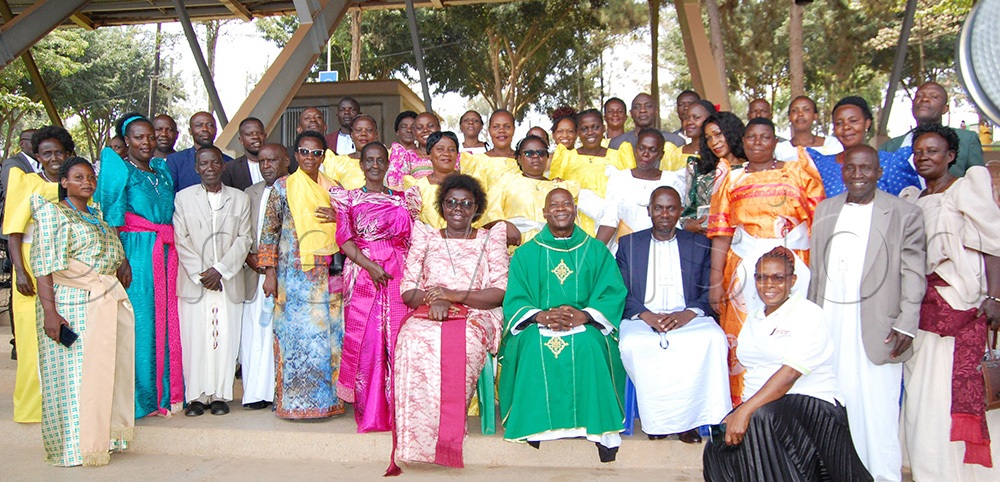 The Christians from Wakiso Parish (who donated sh30m) with their parish priest, Fr. Ronnie Mubiru (wearing a green chasuble), during the function. (Photo by Mathias Mazinga)