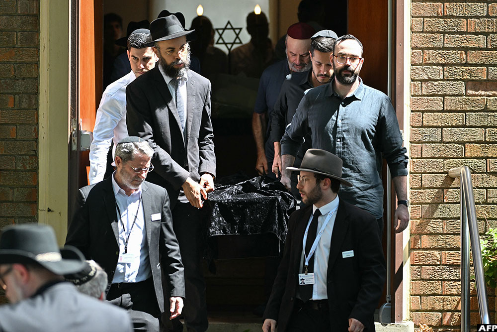 Pallbearers carry out a coffin after the funeral of Boris and Sofia Gurman, who were killed in the December 14 Bondi Beach shooting attack.