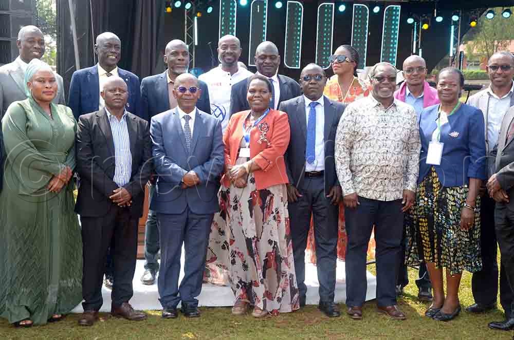 The minister of state for higher education, Dr. John C Muyingo, with some of the officials from the Ministry of Education and Sports, after the opening of the National Secondary Schools Music, Dance and Drama festival at Kings Budo on Friday. (Credit: Job Nantakiika)