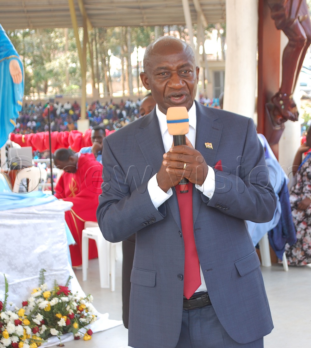 The head of the Catholic laity in Uganda, Gervase Ndyanabo delivering his speech. (Photo by Mathias Mazinga)
