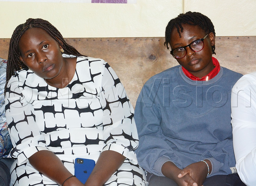 Pellan Atumuhiriize (Right) who was assulted by ASP Clive Nsiima Barigye attending City Hall court where Nsiima was produced and charged with assult and malicious damage. (Photo by Edward Luyimbaazi)