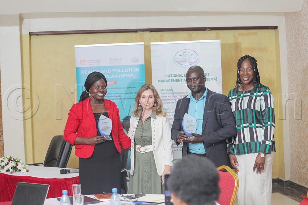 The executive director, GAPH Maria Paola, posing for a photo with officials from NEMA after receiving recognition awards. (Credit: Agnes Kyotalengerire)