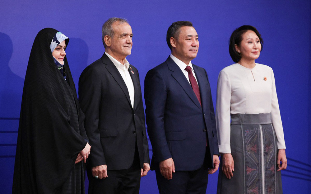 Iran's President Masoud Pezeshkian and his daughter Zahra pose with Kyrgyzstan's President Sadyr Japarov and first lady Aigul prior to the opening ceremony of the 6th World Nomad Games at the Bishkek Arena in Bishkek on August 31, 2026. (Photo by Vyacheslav PROKOFYEV / AFP)