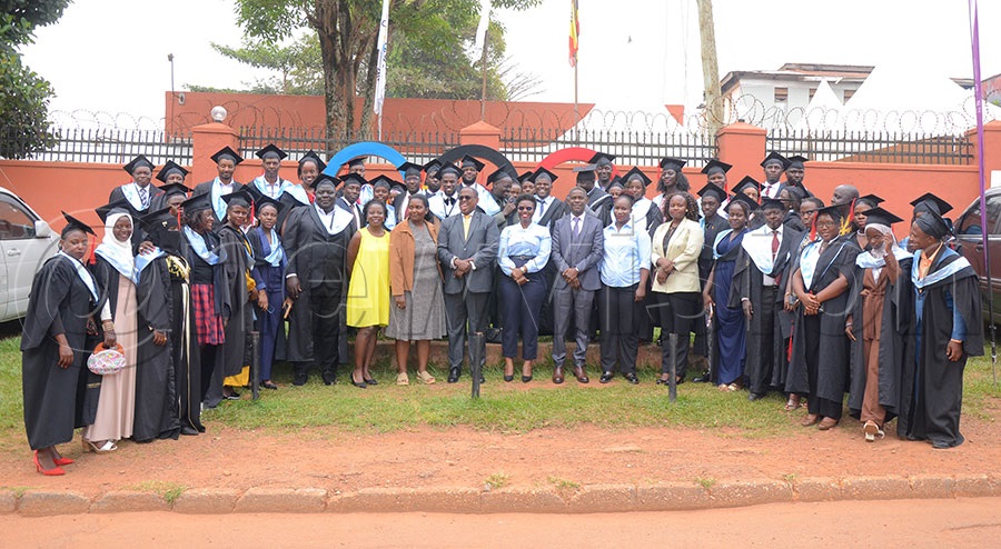 Graduates of the IOC's sports administration courses, pose with lecturers and UOC officials after the ceremony at Lugogo. Photo: Silvano Kibuuka