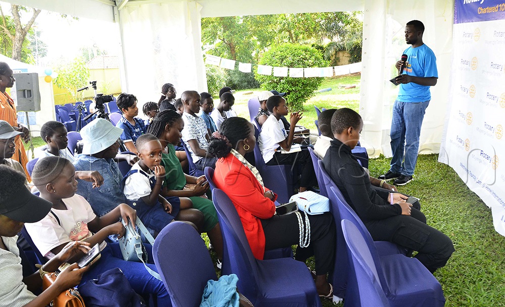 Kenneth Rubango, President of Rotary Club of Muyenga Tank hill addressing students during the Rotary Career Carnival held at Swan Academy, Muyenga. (Photo by Juliet Kasirye)
