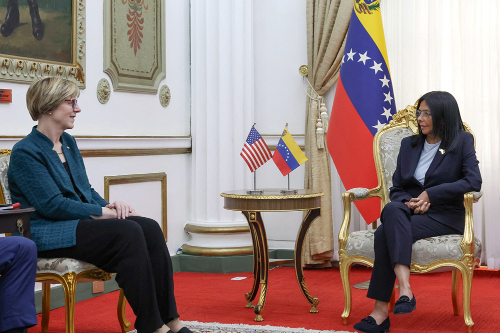 Venezuela's interim President Delcy Rodriguez (R) talking with the new head of the United States diplomatic mission for Venezuela Laura Dogu during meeting at the Miraflores Presidential Palace in Caracas on February 2, 2026. (Photo by DANIELA MILLAN / Venezuelan Presidency / AFP)